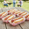 8 hot dog trays on picnic table