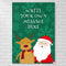 A vertical Christmas-themed poster or print displayed against a white brick wall. The print has a dark green background with lighter green snowflakes, white placeholder text reading 'WRITE YOUR OWN MESSAGE HERE,' a cartoon reindeer with a red scarf, and a cartoon Santa Claus in red and white.