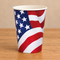 American flag paper cup on the same wooden table with a neutral background