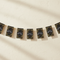 Art Deco Happy New Year Bunting on Cream Wall with Light and Shade