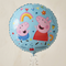 Balloon floating with silver curling ribbon against a neutral background with soft light and shade, close up in square format