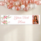 Banner on a cream wall with a close-up balloon arch extending beyond the top and both sides