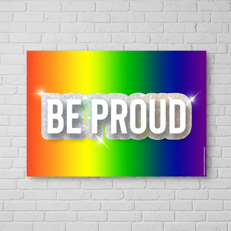 Be Proud Poster on White Brick Wall