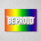 Be Proud Poster on White Brick Wall