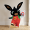 Bing Bunny cardboard cutout on a wooden floor against a neutral wall with soft light and shade, in square format
