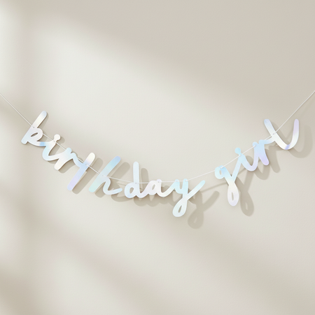 Birthday Girl banner hanging on a softly lit wall