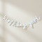 Birthday Girl banner hanging on a softly lit wall