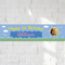 Birthday photo banner on a white brick wall with natural light and shade, in square format