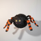 Black and Orange Spider Piñata Hanging with Neutral Background