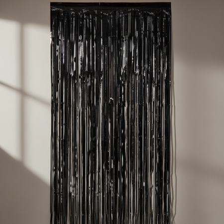 Black Foil Fringe Curtain Against Wall