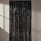 Black Foil Fringe Curtain Against Wall