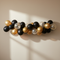Black Gold Silver Balloon Garland on Plain Wall