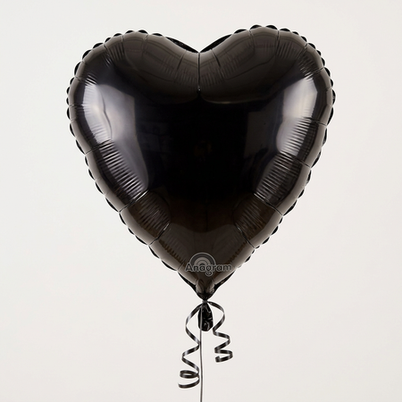 Black heart balloon floating with black curling ribbon, in square format