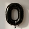 Black number 0 balloon against a softly lit neutral background, in square format
