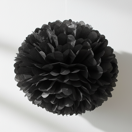 Black Paper Pom Pom on White Textured Wall