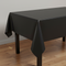 Black Plastic Tablecloth on Table with Wood Floor