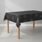 Black Spiderweb Tablecloth on Table Neutral Background
