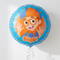 Blippi balloon floating with silver curling ribbon against a white wall with soft light and shade, in a square close-up