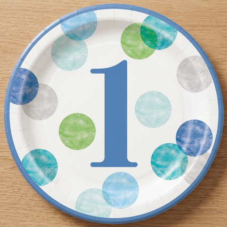 Blue number 1 birthday plate on a wood tabletop, shown close up from above in square format