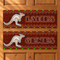 Both banners displayed on a wooden door