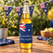 Bottle on a table with an Australia-themed backdrop