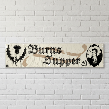 Burns Supper banner on a white brick wall