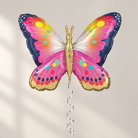 Butterfly balloon floating with silver curled ribbon