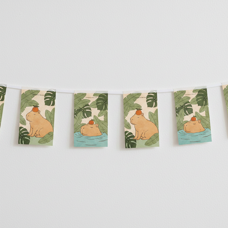 Capybara paper bunting strung across an off-white wall