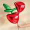 Cherry balloon against a cream wall with soft natural light and shade