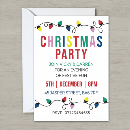 Christmas party invitation on grey wood