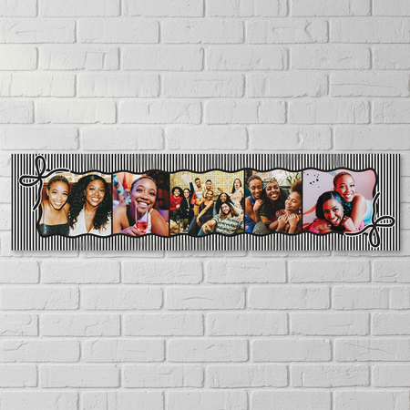 Close-up birthday banner on a white brick wall