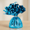 Close-up of the blue foil balloon weight on a matching wooden table with a neutral background, in square format