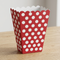 Close-up square image of the red polka-dot treat box on a wooden table