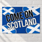 Come On Scotland poster on a white brick wall with soft light and shade, in square format