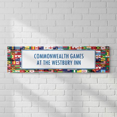 Commonwealth Games Banner on White Brick Wall
