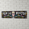 Dia De Los Muertos Banner on White Brick Wall