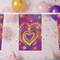Decorative card with heart and musical notes design on a colorful background with balloons.
