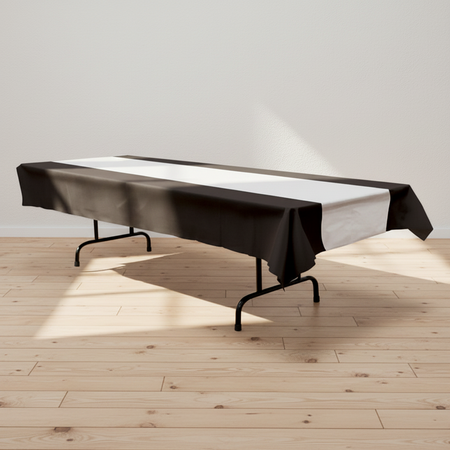Folding table with black and silver cloth on a wood floor