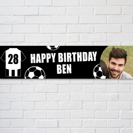 Football birthday banner against a white brick wall with natural light and shade, in square format