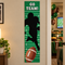 Full-length American football banner beside an open Super Bowl party doorway, in square format