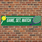 Game Set Match Banner on Red Brick Wall