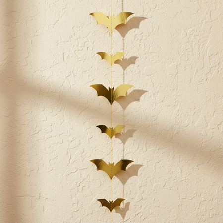 Gold Bat Garland on Cream Textured Wall