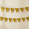 Gold bunting against a cream neutral wall