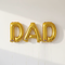 Gold DAD Foil Balloons on Wall