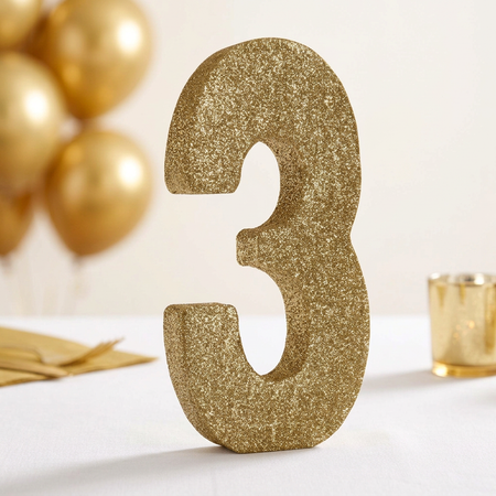 Gold glitter number 3 in a softly styled gold celebration table setting, square format