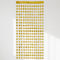 Gold heart foil curtain hanging against a white wall with soft light and shade