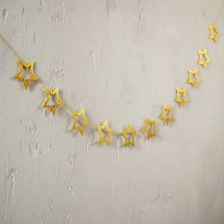 Gold Star Garland on Pale Neutral Wall