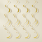 Gold swirls against an off-white wall