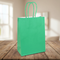 Green Party Bag on Wood Table