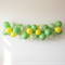 Green Yellow Balloon Garland on White Wall